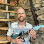 john with his fender ukulele